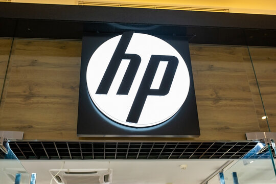 HP, Hewlett Packard store. Signboard with HP brand logo above  entrance to store. Minsk, Belarus - February, 2022