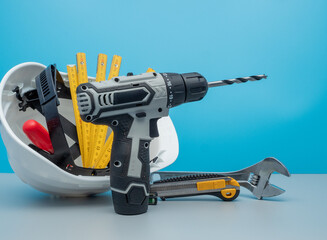 White construction helmet and construction tools.