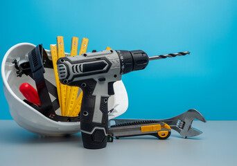 White construction helmet and construction tools.