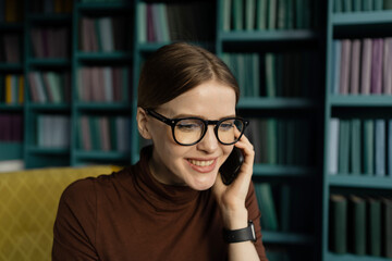 Call phone manager woman working in the office report place. A student with glasses in the library.