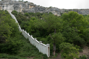 valley. mountains. stone fence
