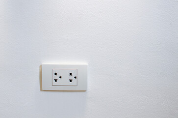 Thailand power socket, electrical plug  isolated on the white wall background