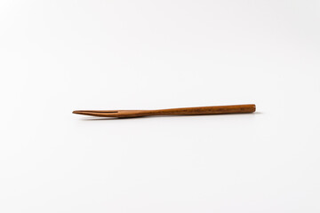wooden fork on a white background