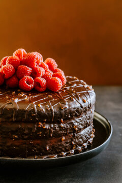 Chocolate layer cake with dulce de leche, butter cream, ganache and raspberries