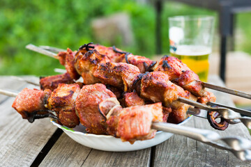 Top view of tasty shish kebab from pork on plate