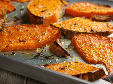 Pumpkins wedges roasted with garlic and rosemary