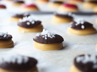 raw choux pastry with chocolate cookie crust and sugar pearl topping