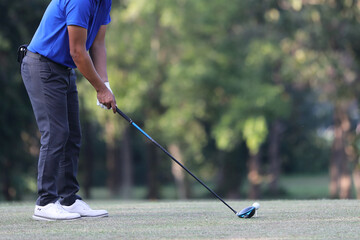 Young male golfer player on golf course