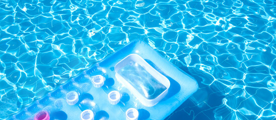 Flat view swimming pool background.Blue water in swimming pool background.Sun glare on the water,travel background