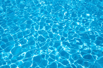Fototapeta na wymiar Flat view swimming pool background.Blue water in swimming pool background.Sun glare on the water,travel background