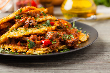 Hungarian potato pancake with goulash