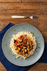 Pork chop with peppers, mushrooms and bamboo. Served with rice.