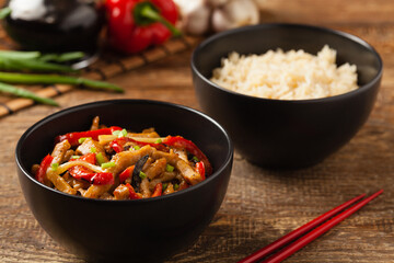 Pork chop with peppers, mushrooms and bamboo. Served with rice.