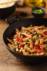 Pork chop with peppers, mushrooms and bamboo. Served with rice.