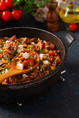 Traditional Greek cuisine. Lamb stew with feta cheese and vegetables.