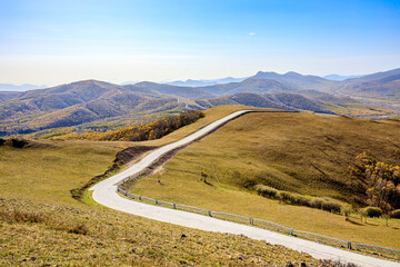 Empty road and mountain natural scenery in autumn season
