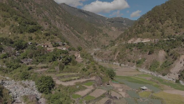 Terrace fields farms vegetable paddy approaching mountainous revealing valley fast aerial right trucking wide angle reveal in kabayan benguet philippines