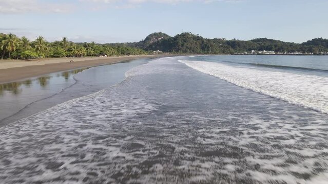 Quepos Beach on the lush, secluded Damas Island. Aerial wide angle dolly-in
