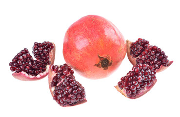 Whole and sliced ripe pomegranate on an isolated white background
