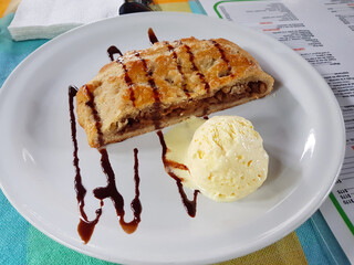 Image of tiramisu with vanilla ice cream with chocolate decoration