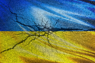 Flag of Ukraine with shelling texture on a concrete wall.
