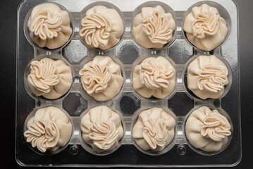 Traditional raw khinkali, georgian cuisune.