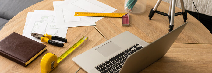 Tools and papers with sketches on the table © Angelov