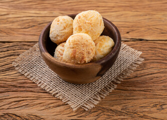 Typical brazilian cheese bun in a bowl over wooden table