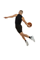 Fototapeta premium Flying. Portrait of basketball player jumping with ball isolated on white studio background. Sport, motion, activity concepts. Dunk, jam, stuff technic