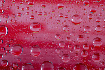 Water droplets on glasss as background