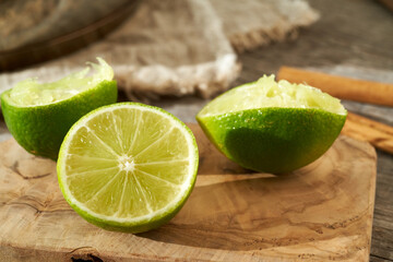 Fototapeta na wymiar Halved fresh lime on a wooden table