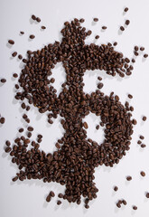 symbolic picture of coffee beans forming a dollar sign as symbol for increasing coffee prices