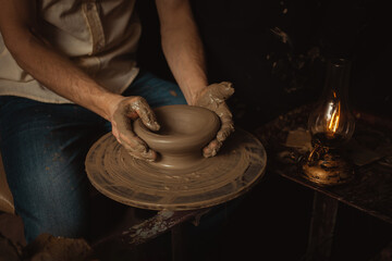 man makes Plate in pottery workshop, clay product, authentic atmosphere, background, footage. Lifestyle, indoor, cinema. Macro, close-up, hands.