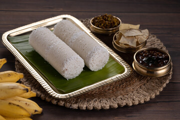 Fototapeta na wymiar Puttu or Raw rice puttu/Arisi Maavu Puttu with chana curry/ kadala curry-Kerala special breakfast items
