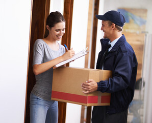 It always arrives on time. Shot of a courier making a delivery to a smiling customer.