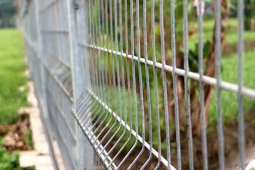 Wire Fence Airport Extreme Close Up Green Background