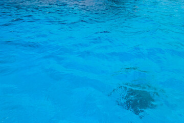 Blue water texture background. Surface of sea or ocean