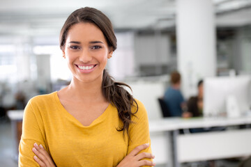 Fototapeta premium Its about taking hold of every opportunity. Cropped shot of an attractive young businesswoman in the office.