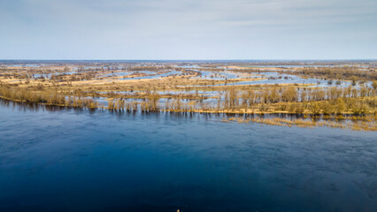 Aerial view flooded forest and fields. The high waters flooded a big area of farm land.