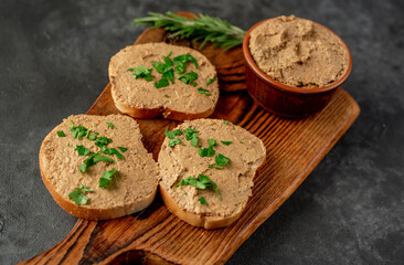 Toasts with beef and pork pate on stone background