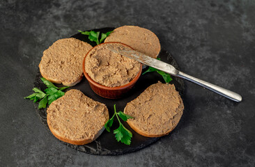 Toasts with beef and pork pate on stone background