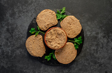 Toasts with beef and pork pate on stone background