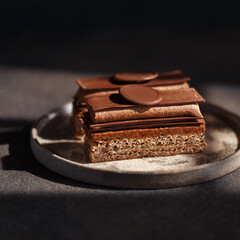 Chocolate layered cake with praline, ganache, almond dacquoise