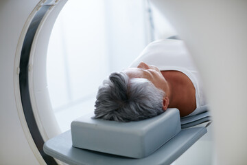 Preventative medical technology. Shot of a senior woman about to have an MRI scan. - obrazy, fototapety, plakaty
