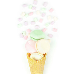 Waffle horn with colored marshmallow looks like macaroons. Creative and moody minimal concept.