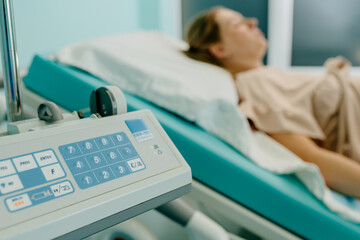 Tired pregnant woman resting between contractions in hospital delivery room. Selective focus