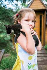 cute girl holding lovely kitty