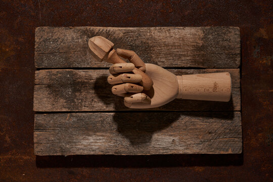 Wooden hand with reamer on cutting board
