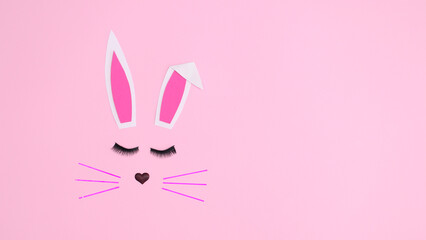 Creative monochrome Easter bunny on pastel pink background. Flat lay copy space concept. Spring holidays