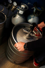Moving a barrel of beer in a bar